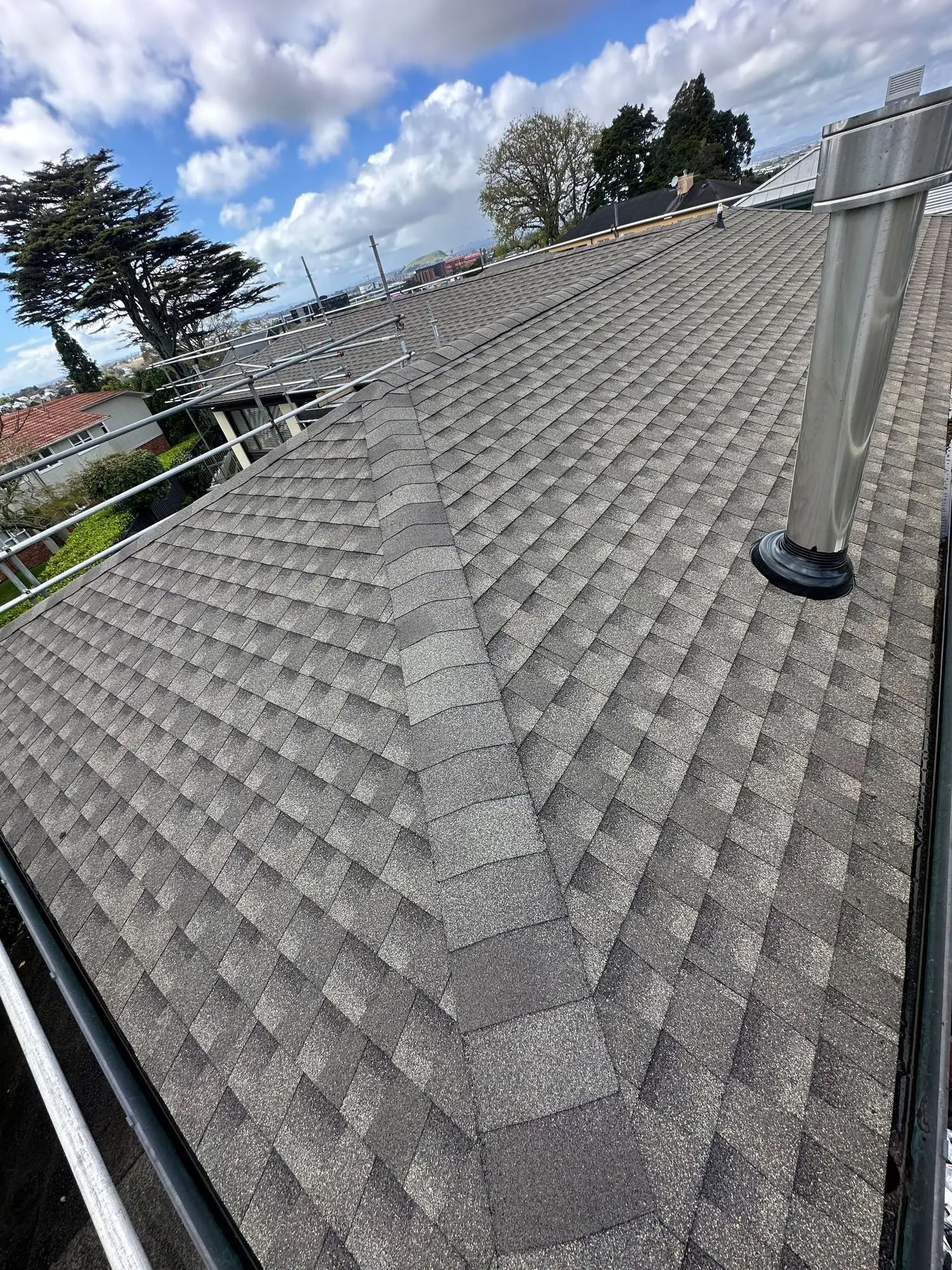 Flashed vent penetrations on an asphalt shingle roof