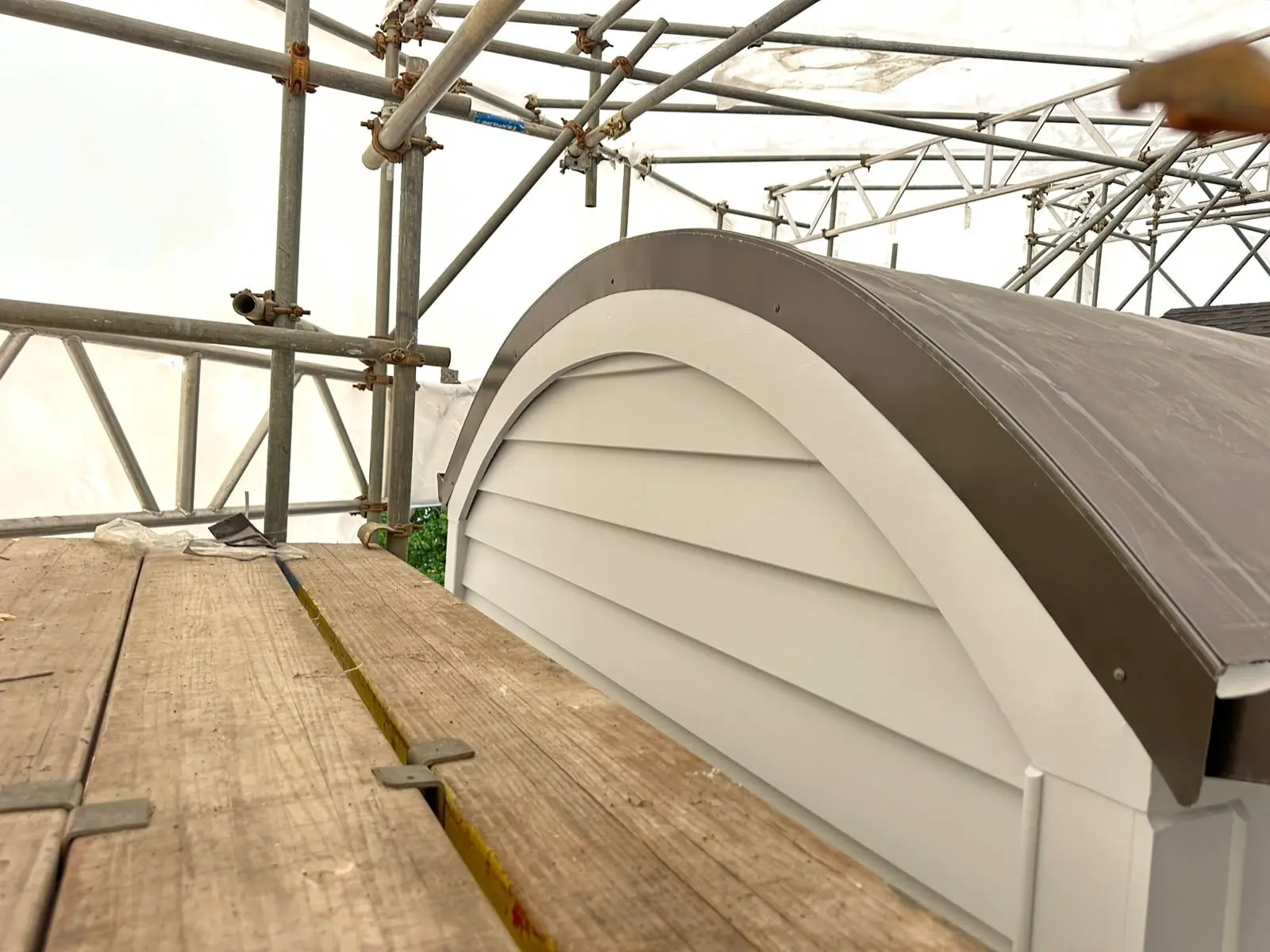 Finished curved barrel dormer with membrane and metal detailing