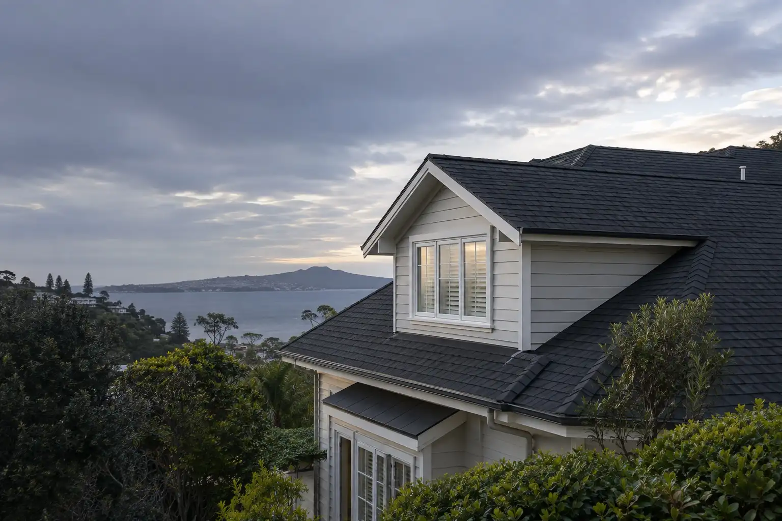 Completed charcoal asphalt shingle roof on an Auckland home