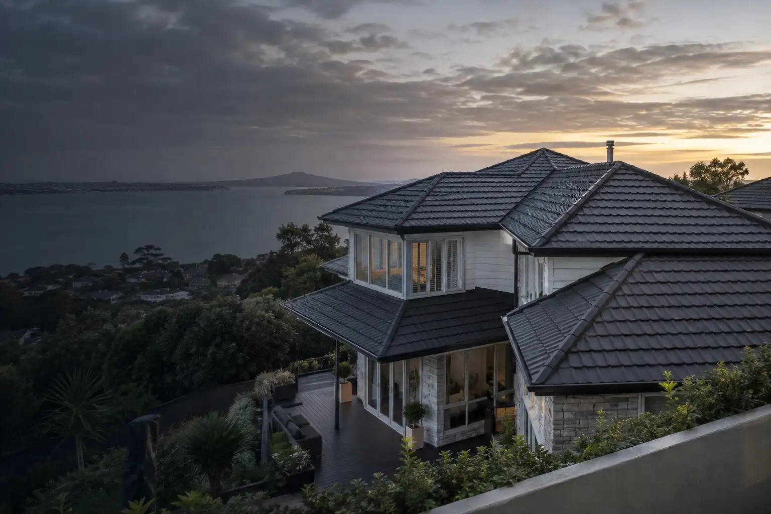 Completed charcoal pressed metal tile roof on an Auckland home