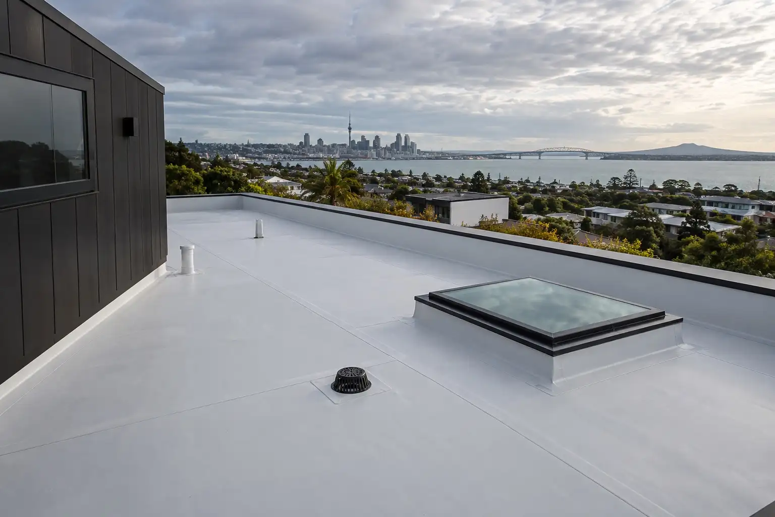 Completed TPO roof with welded seams and skylight in Auckland