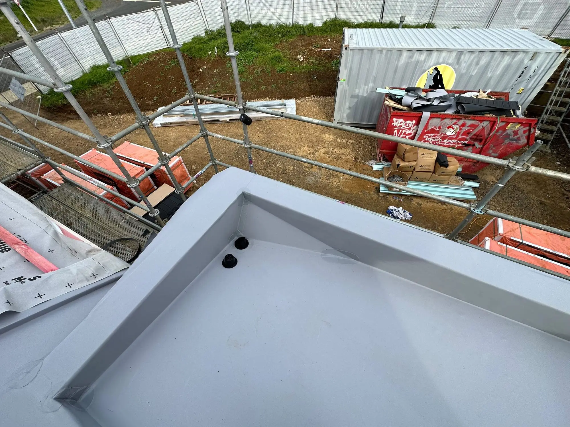 Waterproofed planter box with membrane lining and drainage outlets