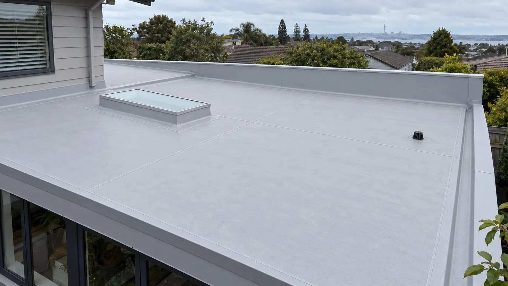Completed TPO membrane roof replacement on an Auckland home