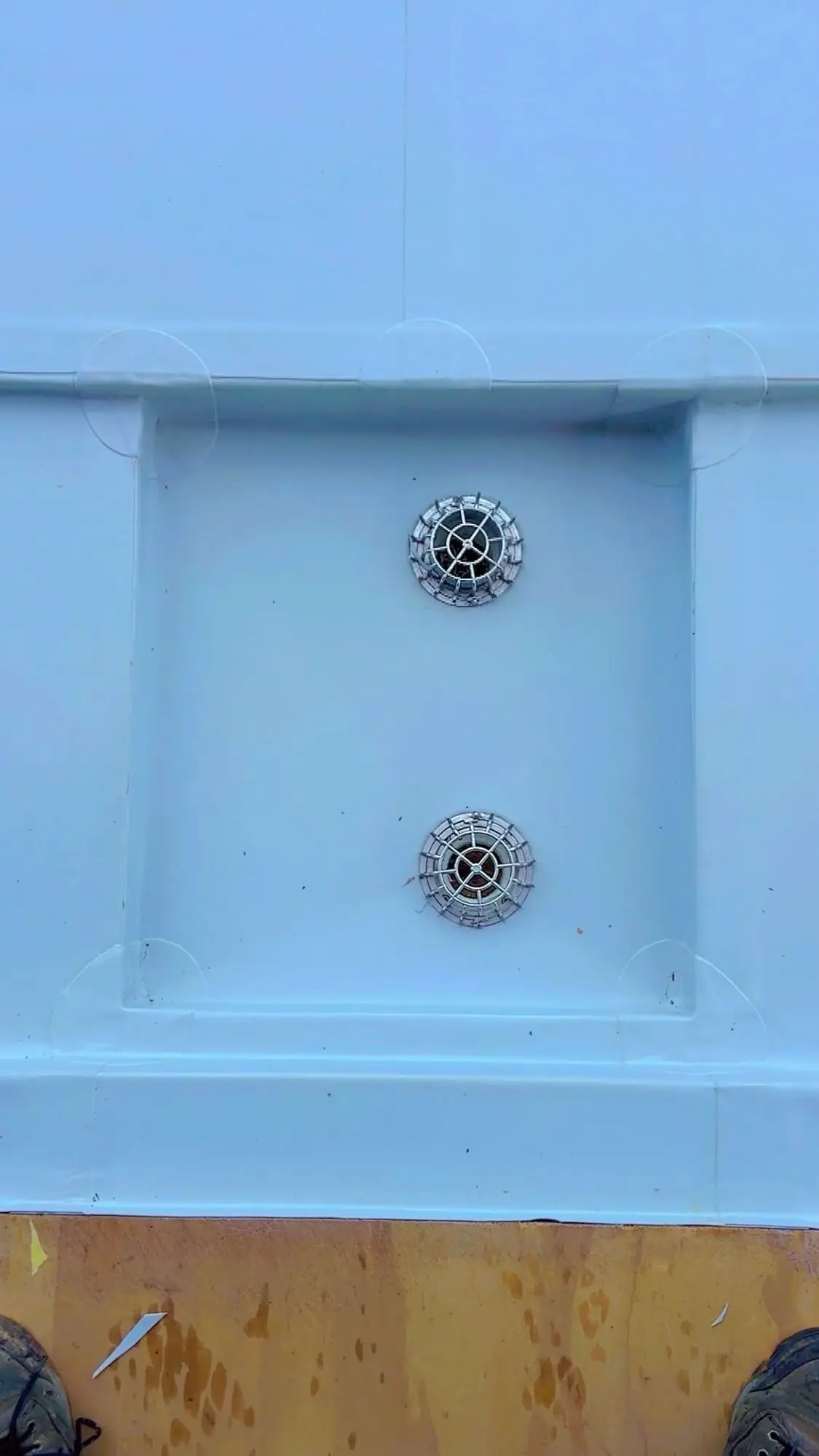 Membrane roof sump with twin outlets installed on an Auckland flat roof