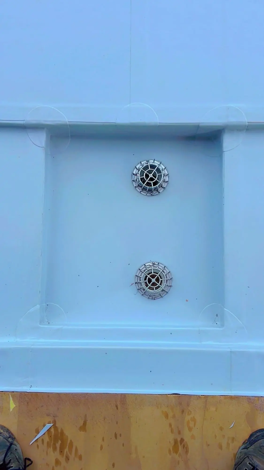 Membrane roof sump with twin outlets installed on an Auckland flat roof